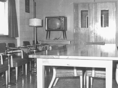 Black and white photo of the Novitiate TV lounge.