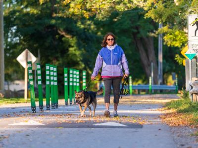 Walker and dog using the Multi-use Pathway